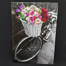 Ansichtkaart met fiets zwart wit en bloemen gekleurd
